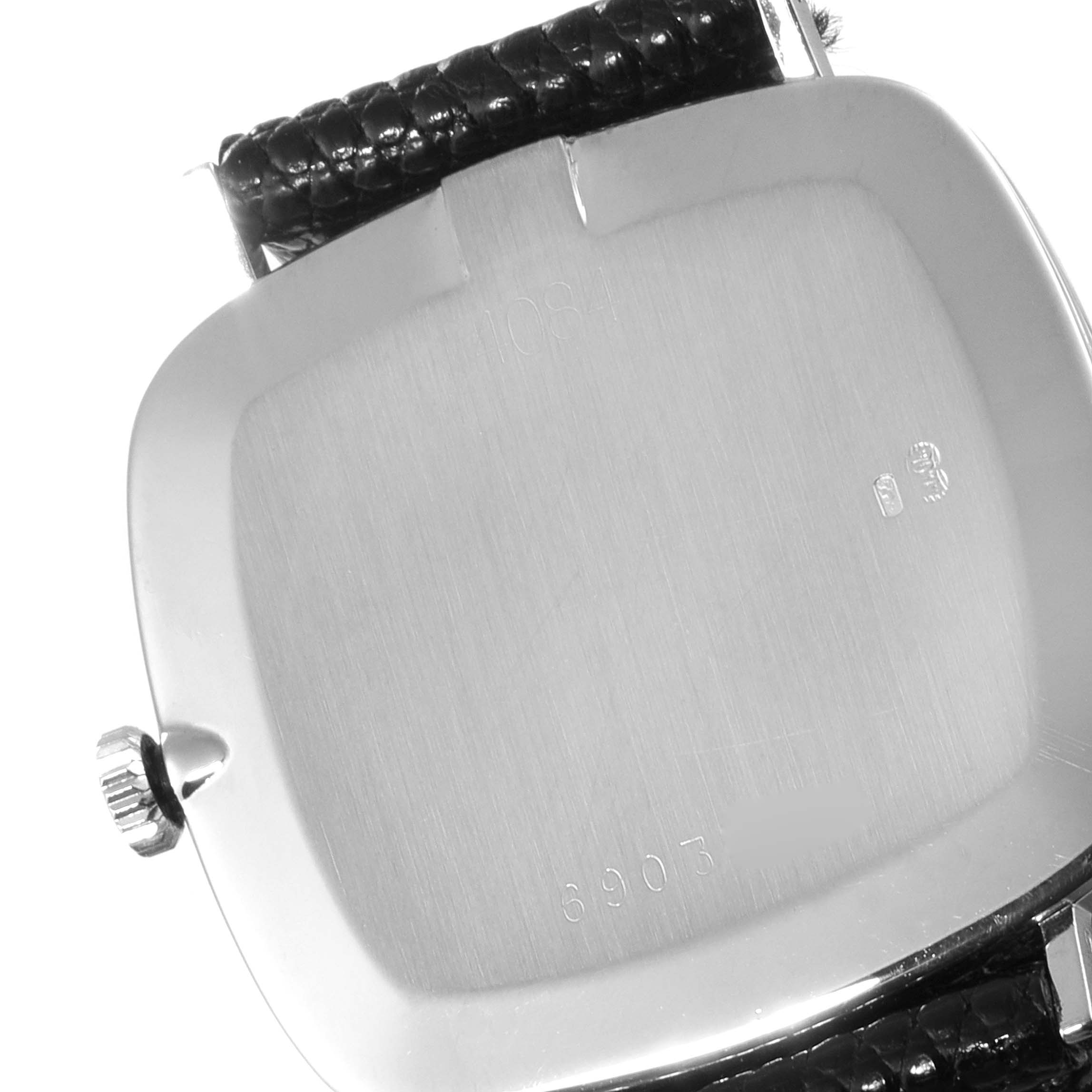 The image shows the back casing and part of the leather strap of a Rolex Cellini 4084 Women's White Gold Blue Dial 4084 Women's White Gold Blue Dial watch.