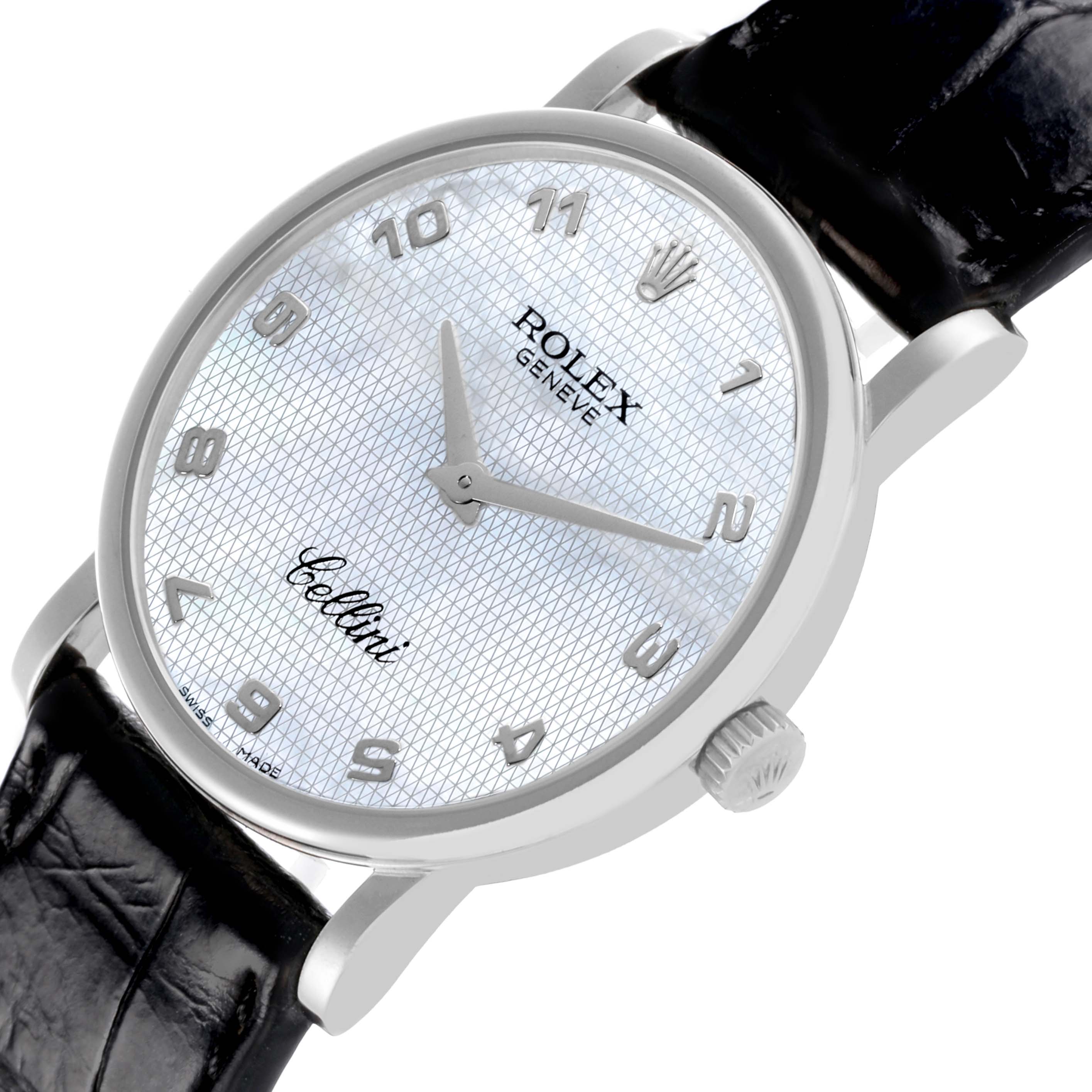 The Rolex Cellini 5115 Men's White Gold Mother of Pearl Dial 5115 Men's White Gold Mother of Pearl Dial watch is shown from a tilted top view, highlighting the dial, case, crown, and leather strap.
