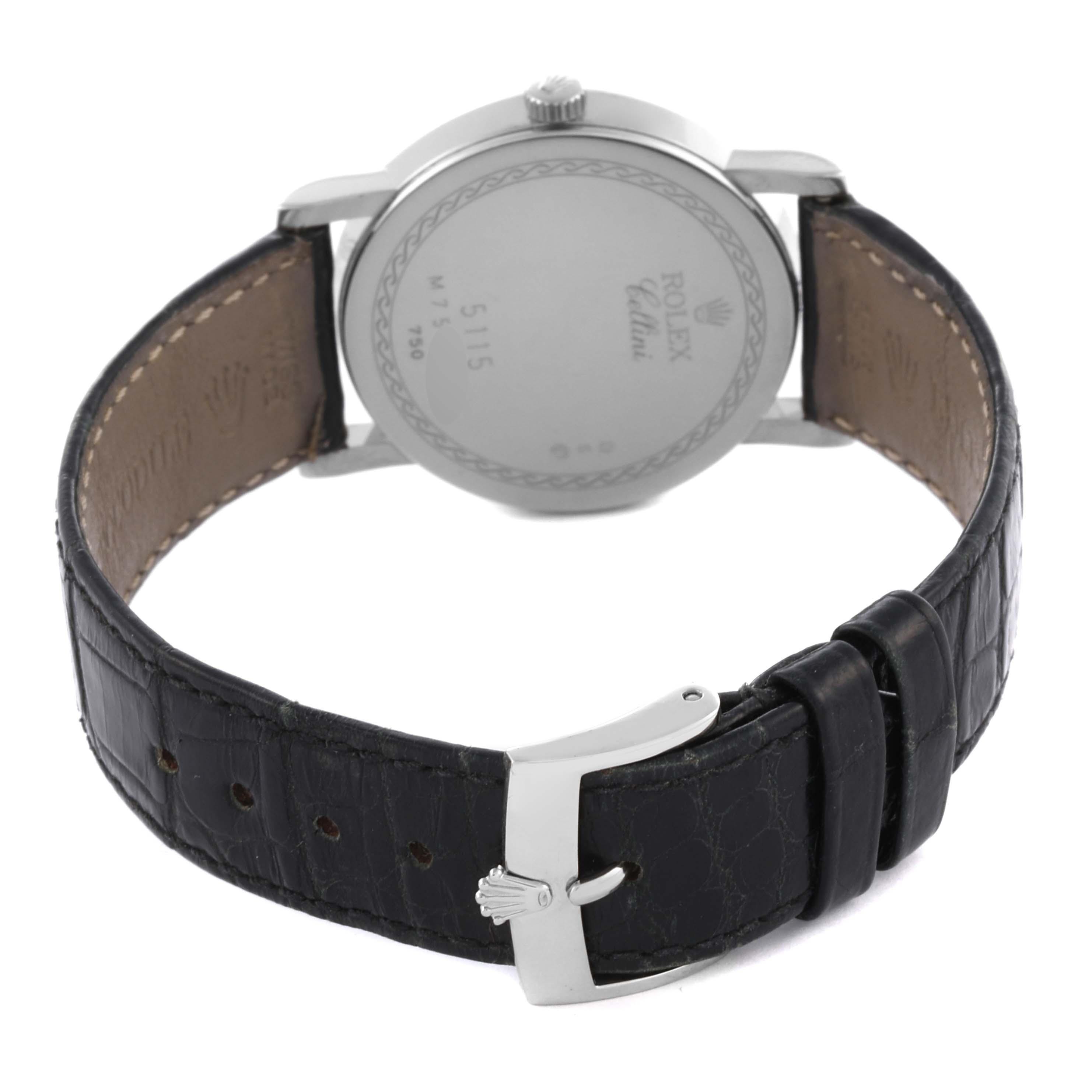 The image shows the back of the Rolex Cellini 5115 Men's White Gold Mother of Pearl Dial 5115 Men's White Gold Mother of Pearl Dial watch and its leather strap with a silver buckle.