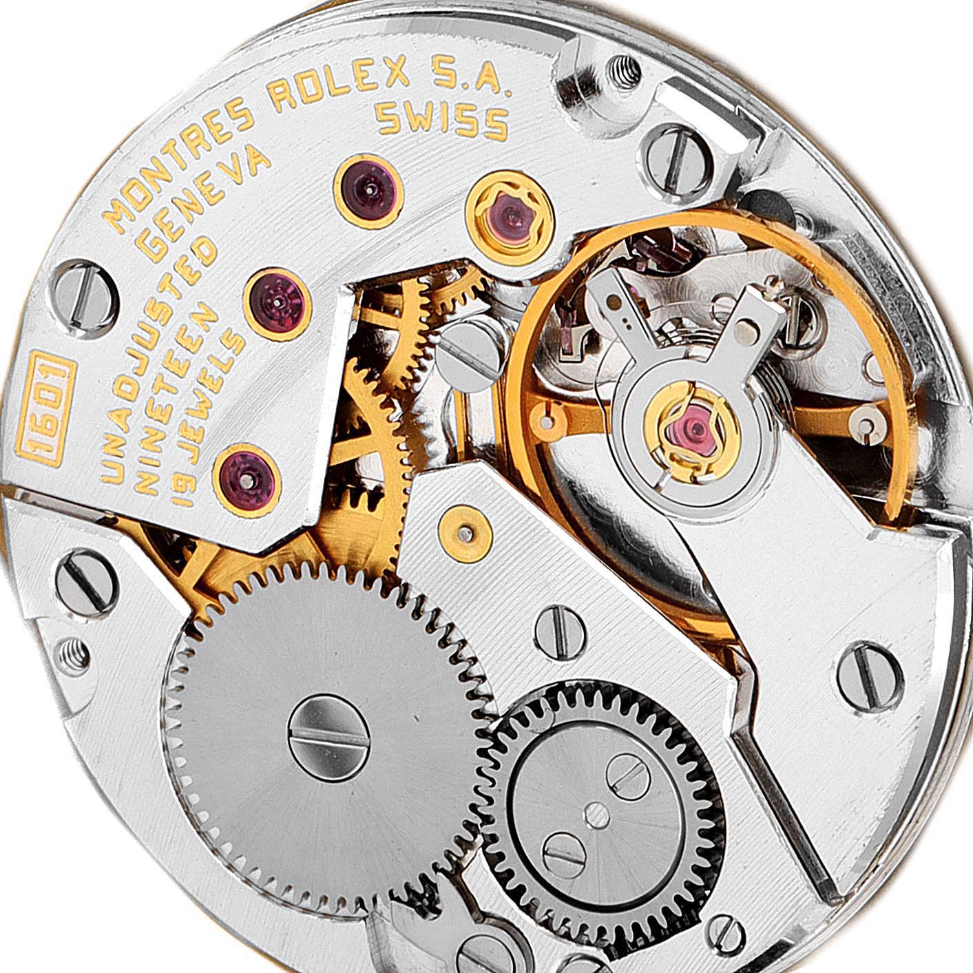 This image shows a close-up of the inner mechanical movement of a Rolex Cellini 5032 Men's White Gold Champagne Dial 5032 Men's White Gold Champagne Dial watch, highlighting gears and jewels.