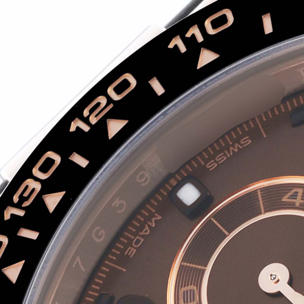 The image shows a close-up of the Rolex Daytona 116515 Men's Rose Gold Brown Dial 116515 Men's Rose Gold Brown Dial watch bezel and partial dial, highlighting the tachymetric scale.