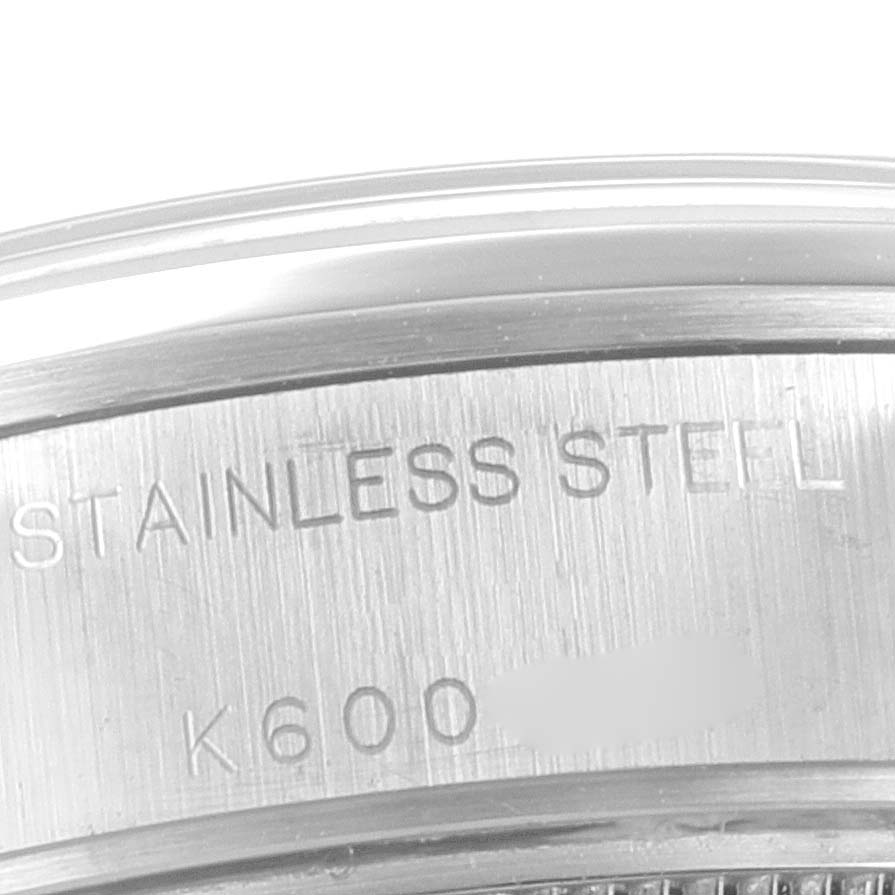 This close-up image shows the case back of a Rolex Date 79160 Women's Stainless Steel White Dial 79160 Women's Stainless Steel White Dial model watch, engraved with "STAINLESS STEEL."