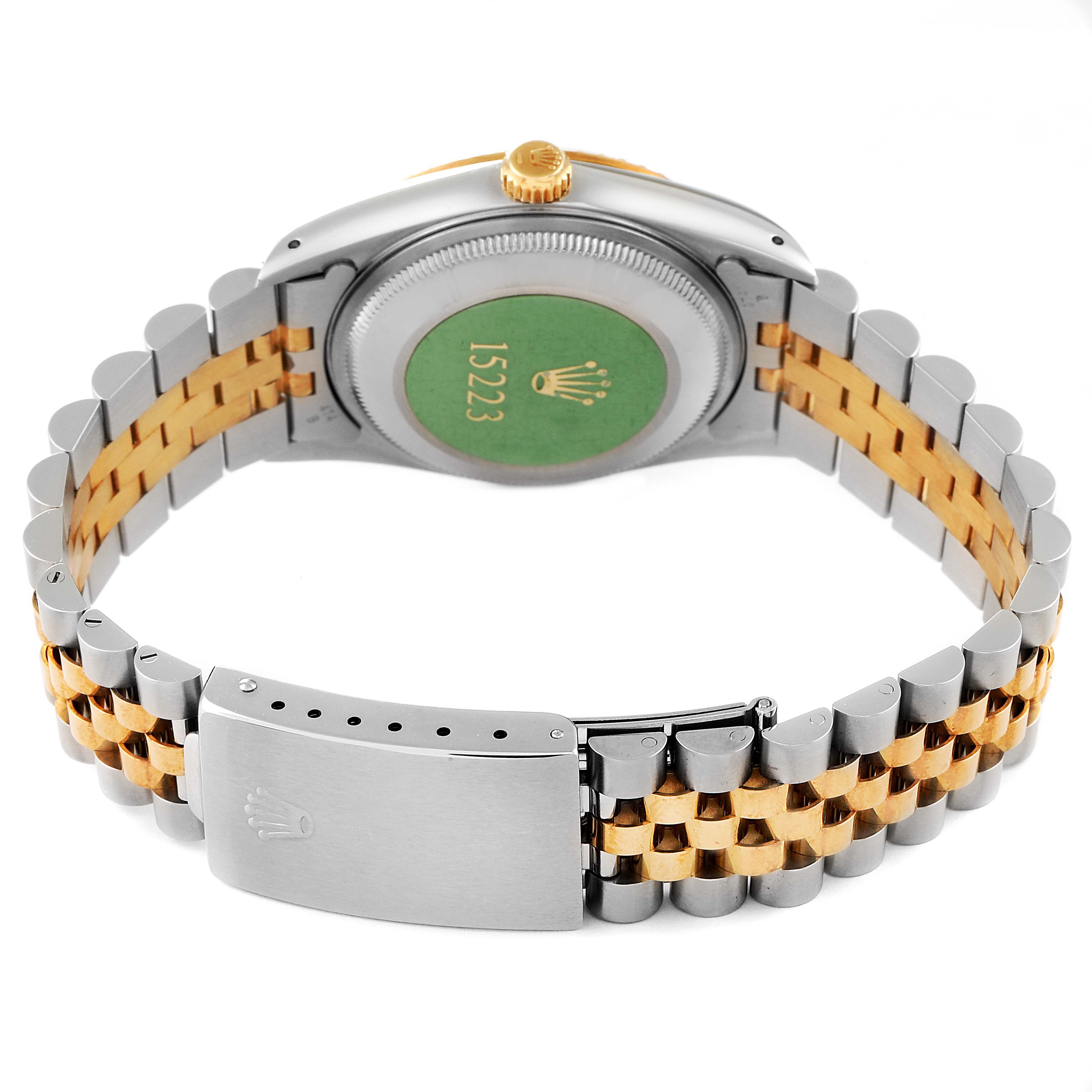 The image shows the back case and bracelet of a Rolex Date 15223 Men's Steel and Gold (two tone) Silver Dial 15223 Men's Steel and Gold (two tone) Silver Dial model watch, highlighting its two-tone design and clasp.