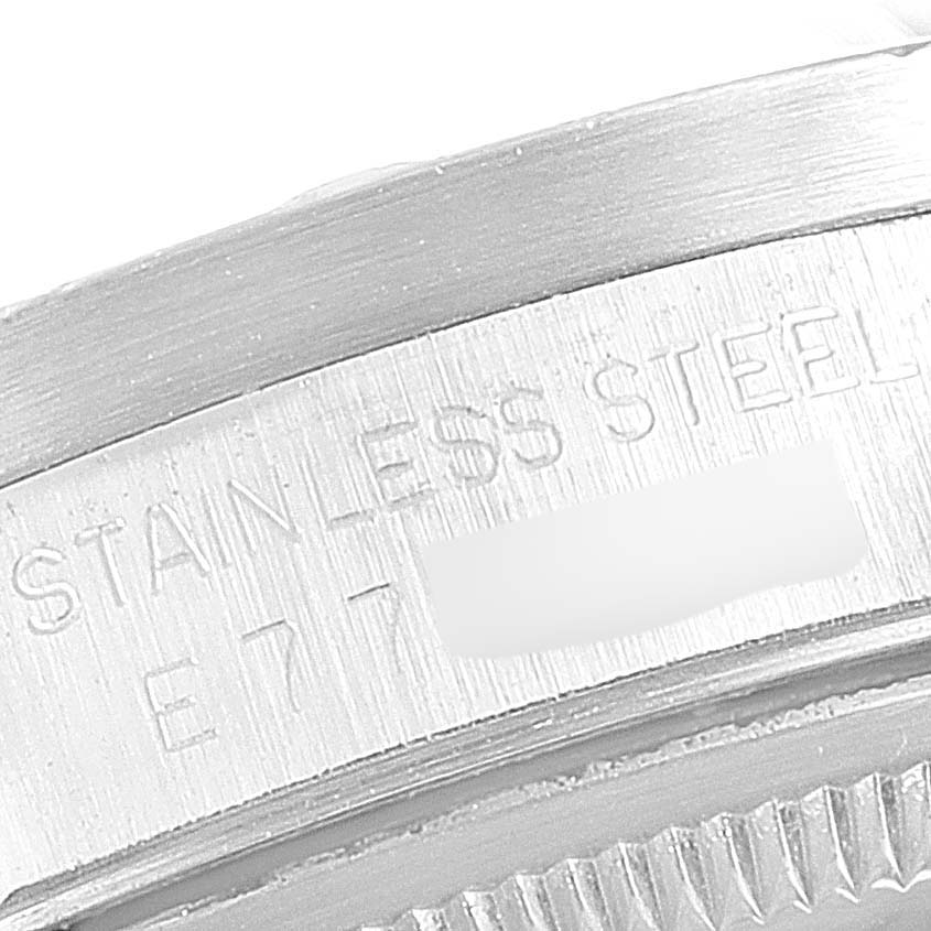 This close-up image shows the stainless steel case back engraving of a Rolex Date 15210 Men's Stainless Steel Silver Dial 15210 Men's Stainless Steel Silver Dial model watch.