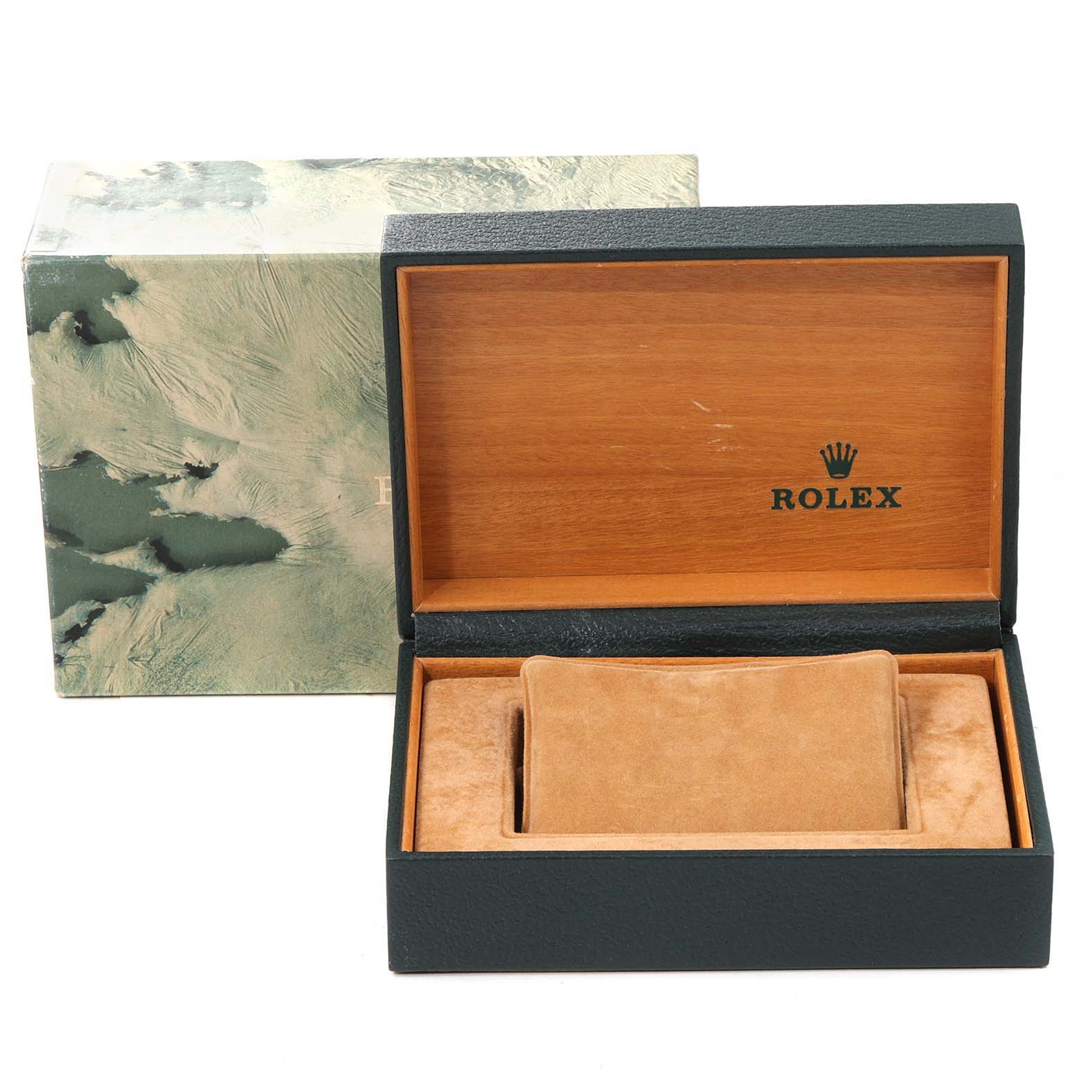 The image shows an open Rolex watch box for the Date model with a cushion for the watch inside.