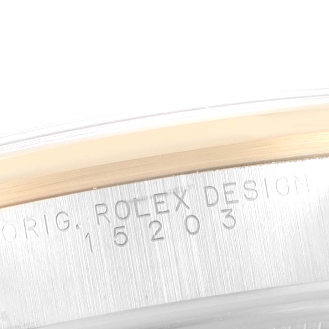 This image shows the case side of a Rolex Date 15203 Men's Steel and Gold (two tone) Black Dial 15203 Men's Steel and Gold (two tone) Black Dial model, featuring the engraved reference number "15203".