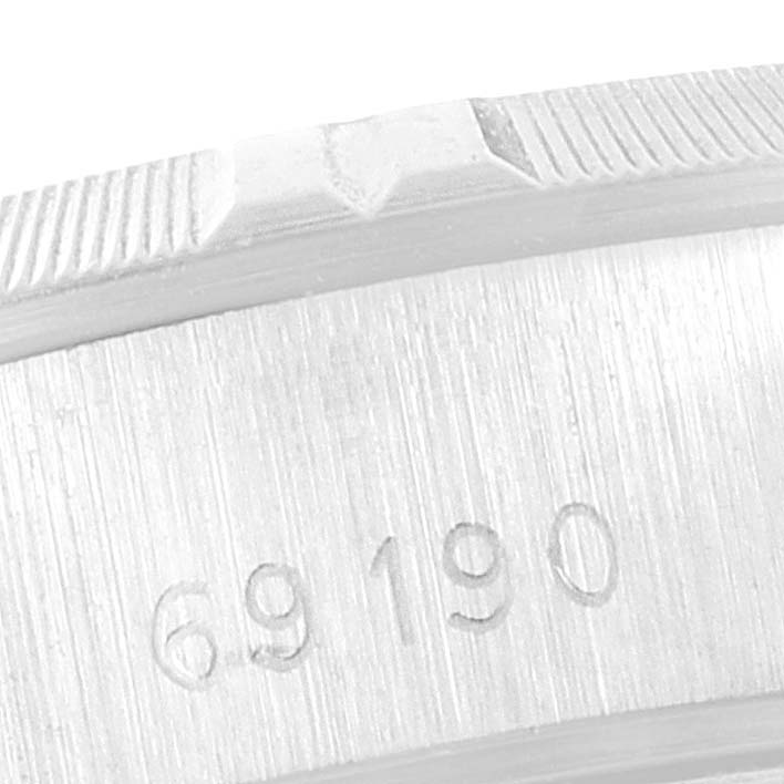 The image shows a close-up of the side of the bezel and case of a Rolex Date 69160 Women
s Stainless Steel White Dial 69160 Women
s Stainless Steel White Dial model watch, highlighting the model number "69190."