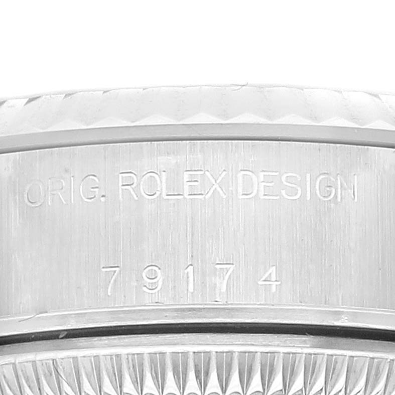 This image shows a close-up view of the Rolex Datejust 79174 Women's Stainless Steel Silver Dial 79174 Women's Stainless Steel Silver Dial model's case side, featuring the serial and design numbers.