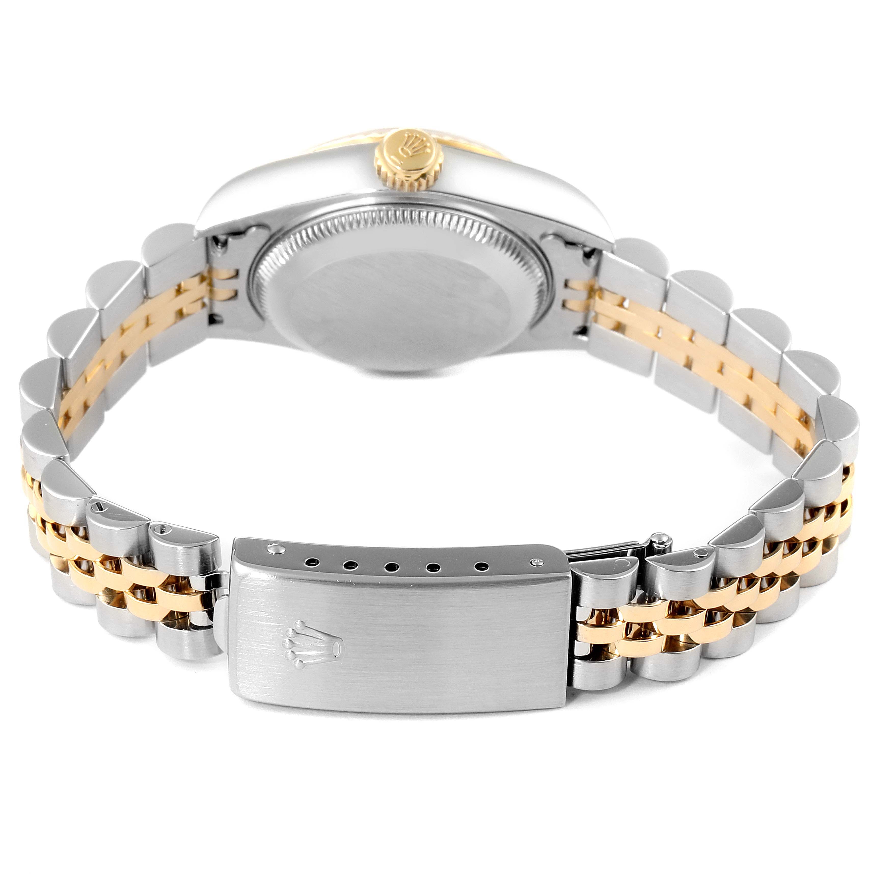 The watch is a Rolex Datejust 79173 Women's Steel and Gold (two tone) Champagne Dial 79173 Women's Steel and Gold (two tone) Champagne Dial model shown from the back angle, displaying its two-tone bracelet and clasp.