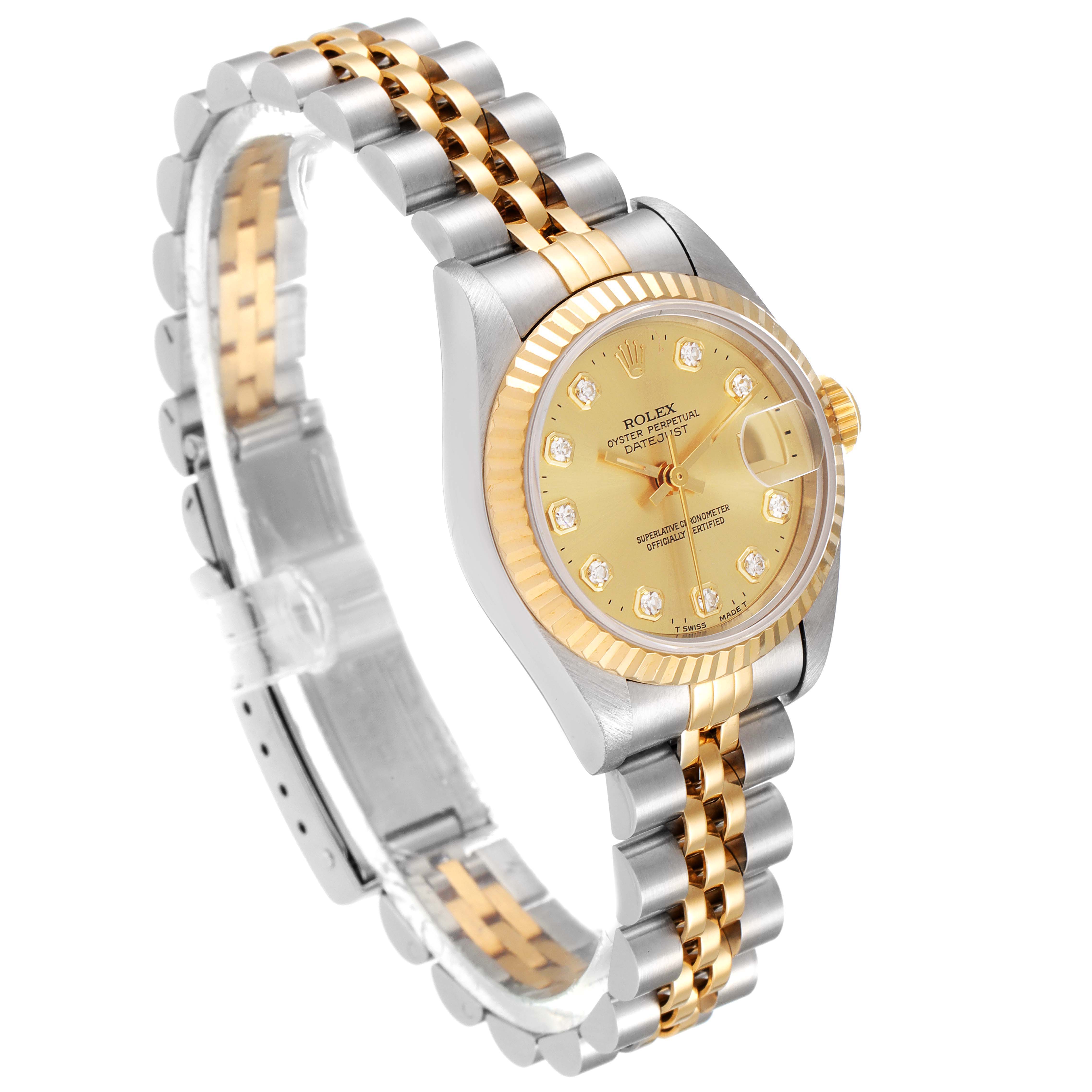 The Rolex Datejust 69173 Women's Steel and Gold (two tone) Champagne Dial 69173 Women's Steel and Gold (two tone) Champagne Dial watch is shown at an angled view, highlighting its gold dial, two-tone bracelet, and fluted bezel.