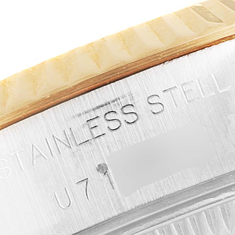 This close-up image shows the bezel, serial number, and "STAINLESS STEEL" engraving on a Rolex Datejust 69173 Women's Steel and Gold (two tone) Champagne Dial 69173 Women's Steel and Gold (two tone) Champagne Dial watch.