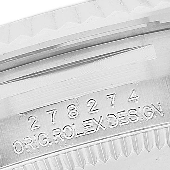 The image shows a close-up angle of the casing and bezel engraving on a Mid-Size Rolex watch.