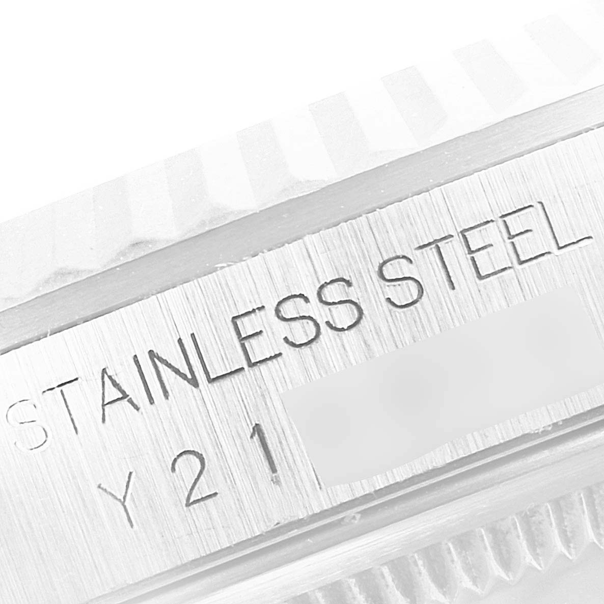 The image shows a close-up of the side engraving on a Rolex Datejust 16234 Men's Stainless Steel Blue Dial 16234 Men's Stainless Steel Blue Dial watch case in stainless steel.