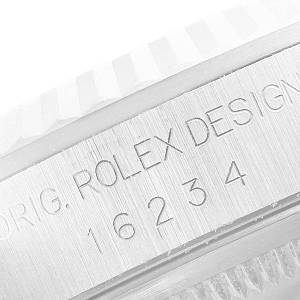 The image shows a close-up of the engraving on the side of a Rolex Datejust 16234 Men's Stainless Steel Blue Dial 16234 Men's Stainless Steel Blue Dial watch case, displaying the model number 16234.