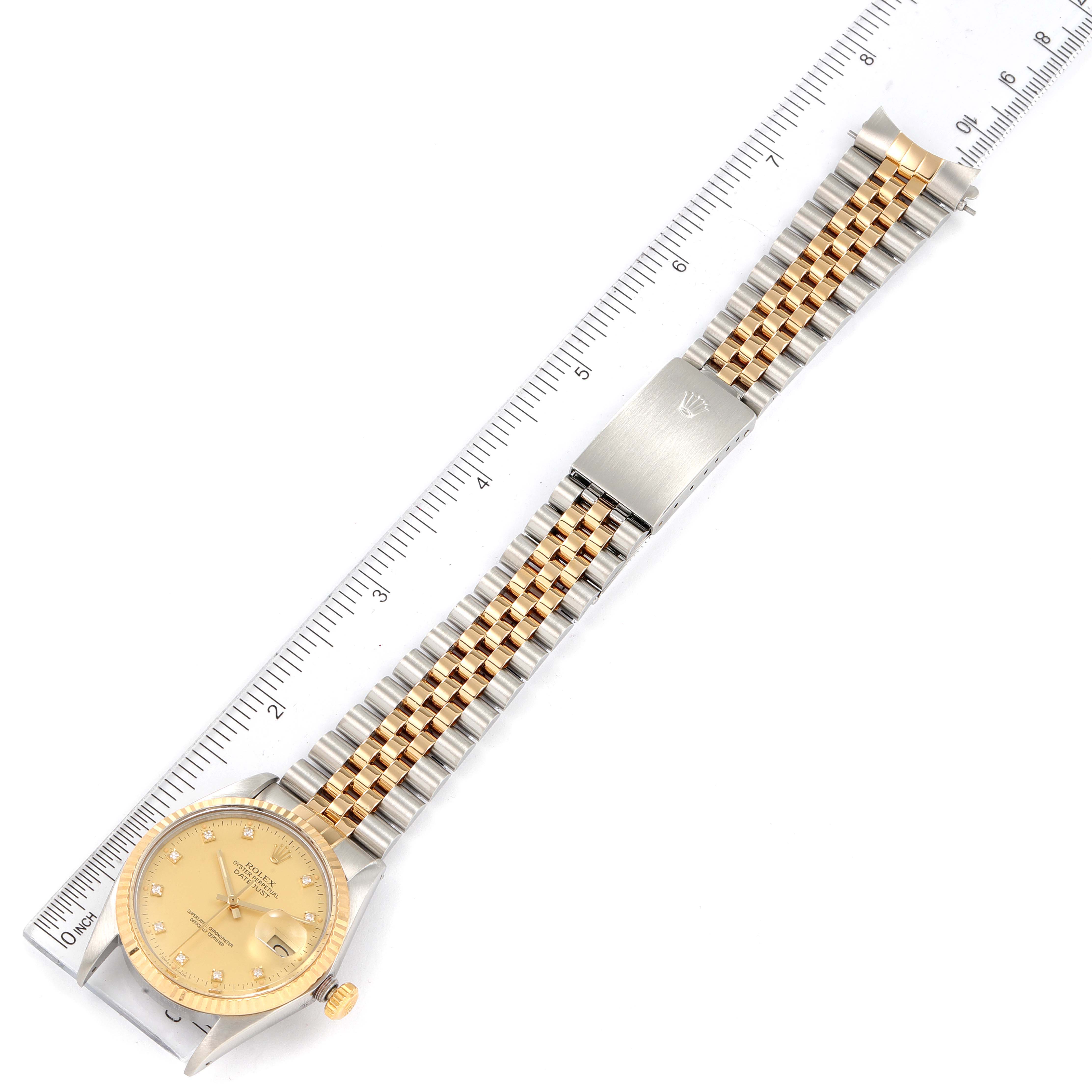 This image shows a Rolex Vintage Collection 16013 Men's Steel and Gold (two tone) Champagne Dial 16013 Men's Steel and Gold (two tone) Champagne Dial watch laid flat, featuring a gold and silver jubilee bracelet and a gold dial.