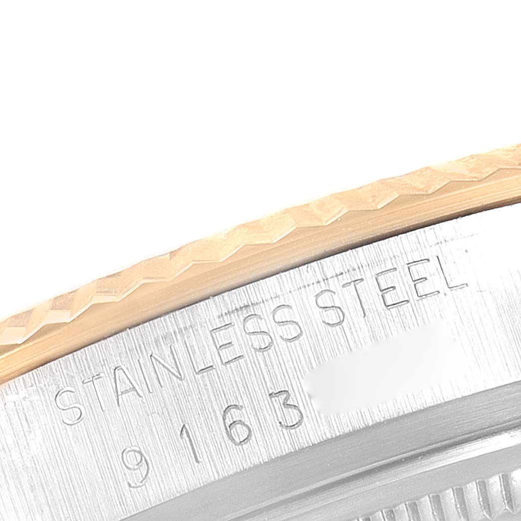 This image shows a close-up of the side of a Rolex Vintage Collection 16013 Men's Steel and Gold (two tone) Champagne Dial 16013 Men's Steel and Gold (two tone) Champagne Dial watch, highlighting the stainless steel case and part of the bezel.