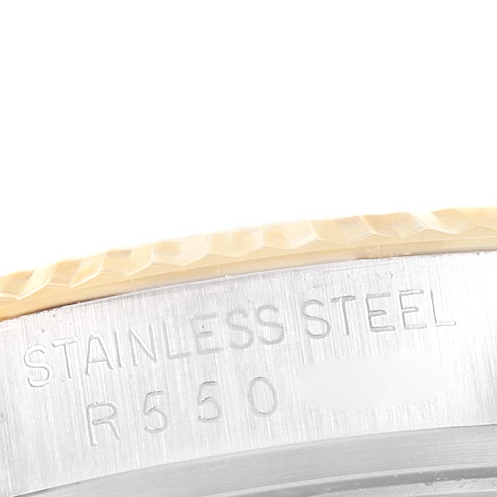 The image shows a close-up side view of the bezel and casing of the Rolex Vintage Collection 16013 Men's Steel and Gold (two tone) Champagne Dial 16013 Men's Steel and Gold (two tone) Champagne Dial watch, highlighting its stainless steel material.