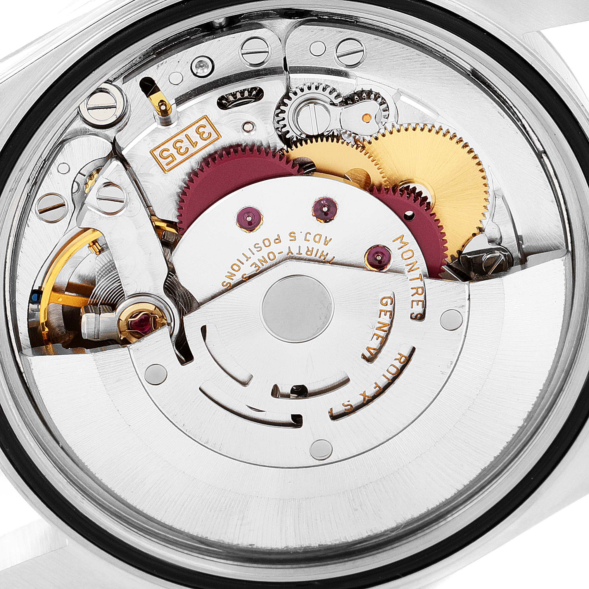The image shows a close-up view of the movement inside a Rolex Datejust 16220 Men's Stainless Steel Black Dial 16220 Men's Stainless Steel Black Dial watch, highlighting gears and mechanical components.