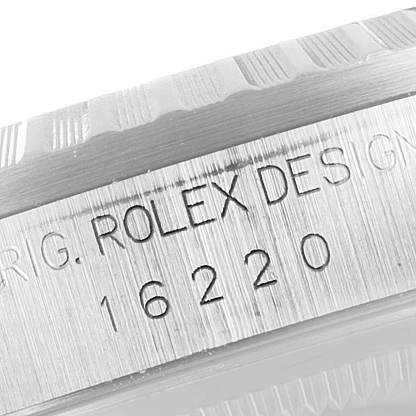 The image shows a close-up of the side case with the engravings "ORIG. ROLEX DESIGN 16220" on a Rolex Datejust 16220 Men's Stainless Steel Black Dial 16220 Men's Stainless Steel Black Dial watch.