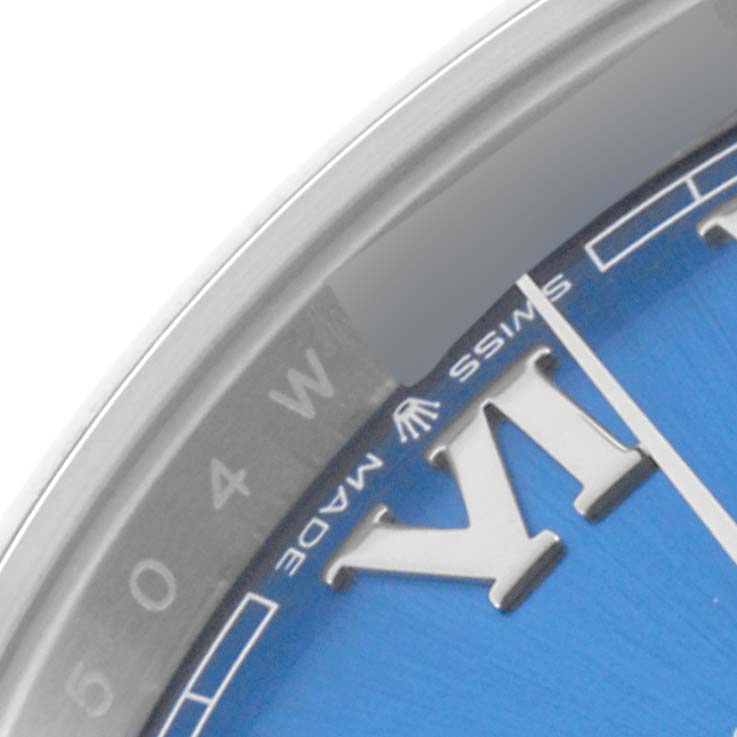 The image shows a close-up of the dial and bezel of the Rolex Datejust 41 126300 Men's Stainless Steel Blue Dial 126300 Men's Stainless Steel Blue Dial, featuring part of the "Swiss Made" text.