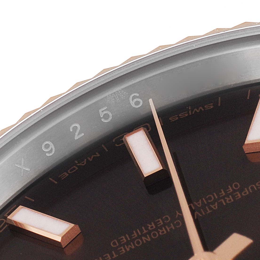 This image shows a close-up of the dial and part of the bezel of the Rolex Datejust 41 126331 Men's Steel and Gold (two tone) Brown Dial 126331 Men's Steel and Gold (two tone) Brown Dial, highlighting the hour markers and minute track.