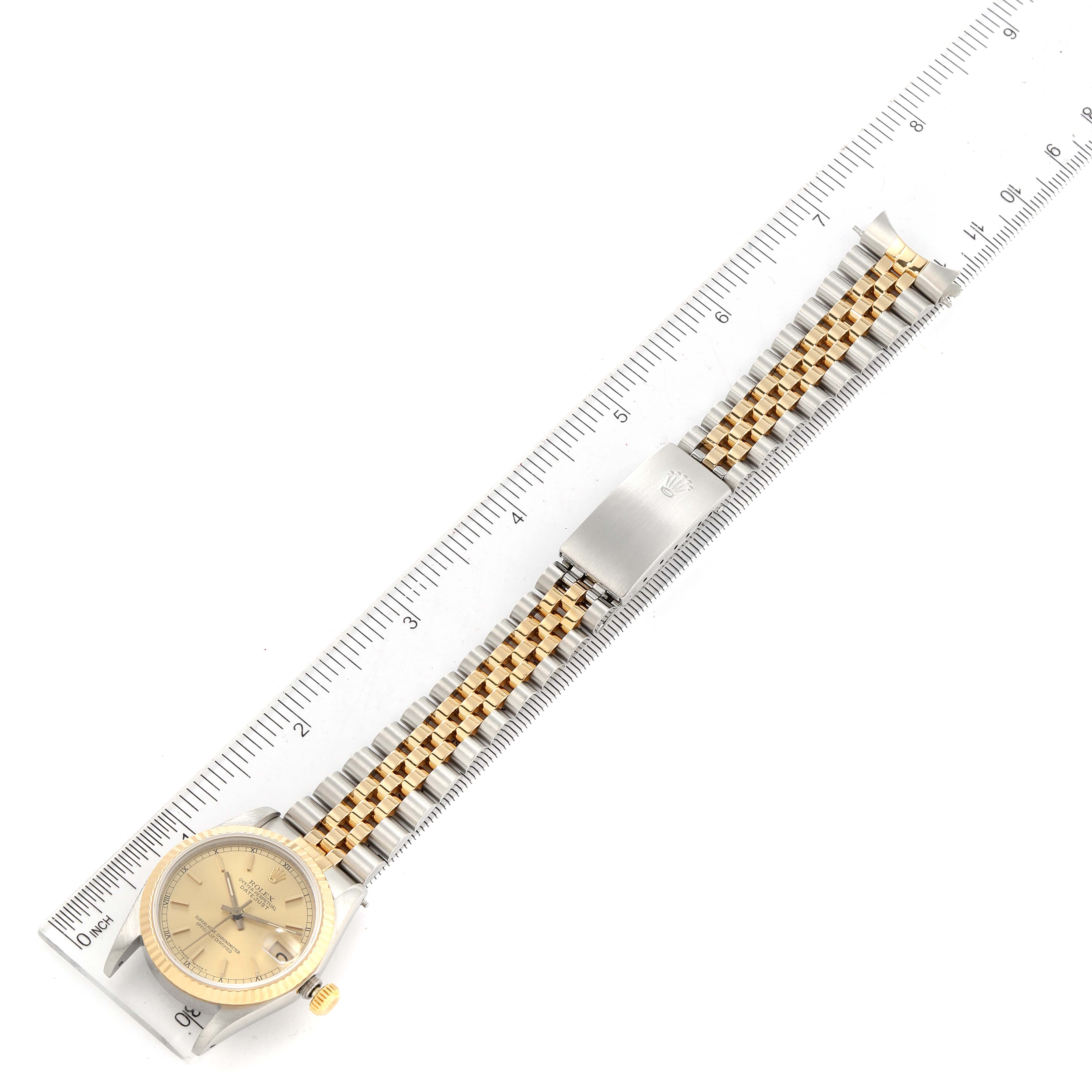 The image shows a Rolex Mid-Size 68273 Women's Steel and Gold (two tone) Champagne Dial 68273 Women's Steel and Gold (two tone) Champagne Dial watch laid flat, displaying the face, bezel, crown, and bracelet with a ruler for size reference.