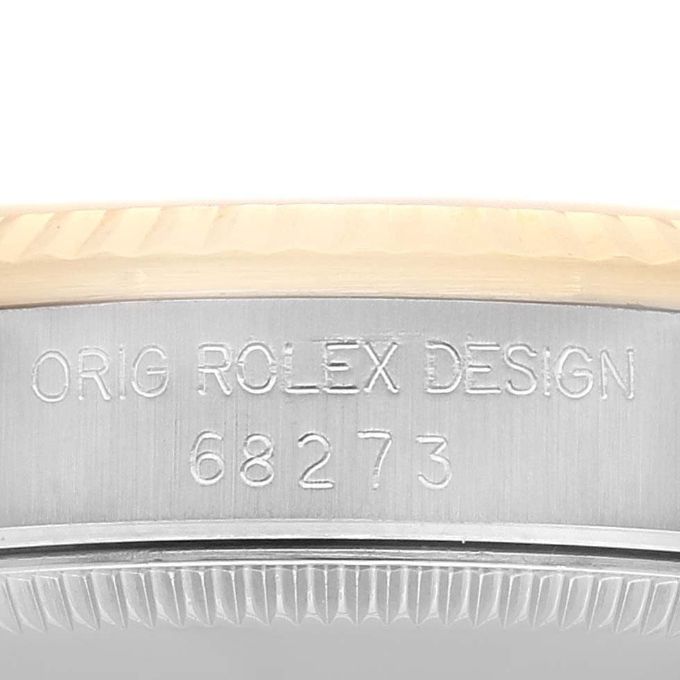 This image shows a close-up angle of the casing side with the model number and "Orig Rolex Design" engraving for a Rolex Mid-Size 68273 Women's Steel and Gold (two tone) Champagne Dial 68273 Women's Steel and Gold (two tone) Champagne Dial watch model 68273.