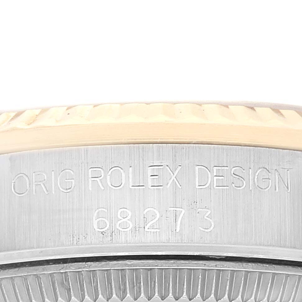 The image shows a close-up of the side view of a Mid-Size Rolex model watch case, featuring the engraved reference number 68273.