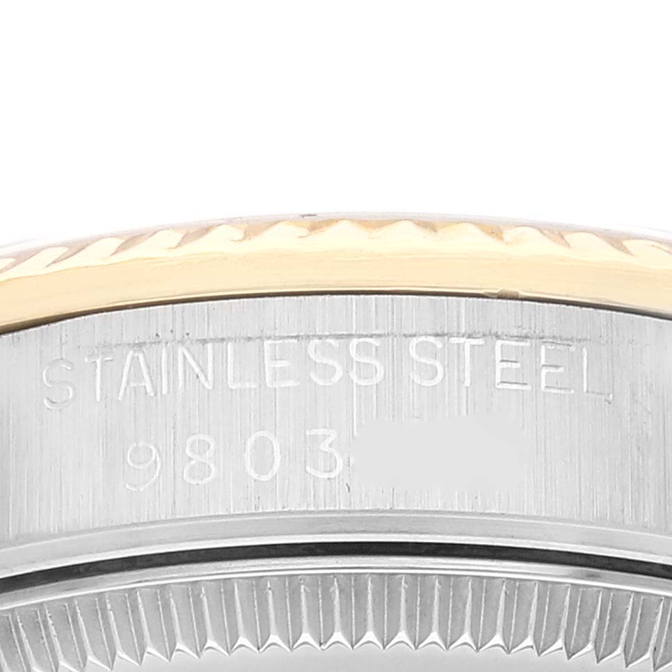 This close-up image of the Mid-Size Rolex watch showcases the engraved stainless steel case back with the model number partially visible.