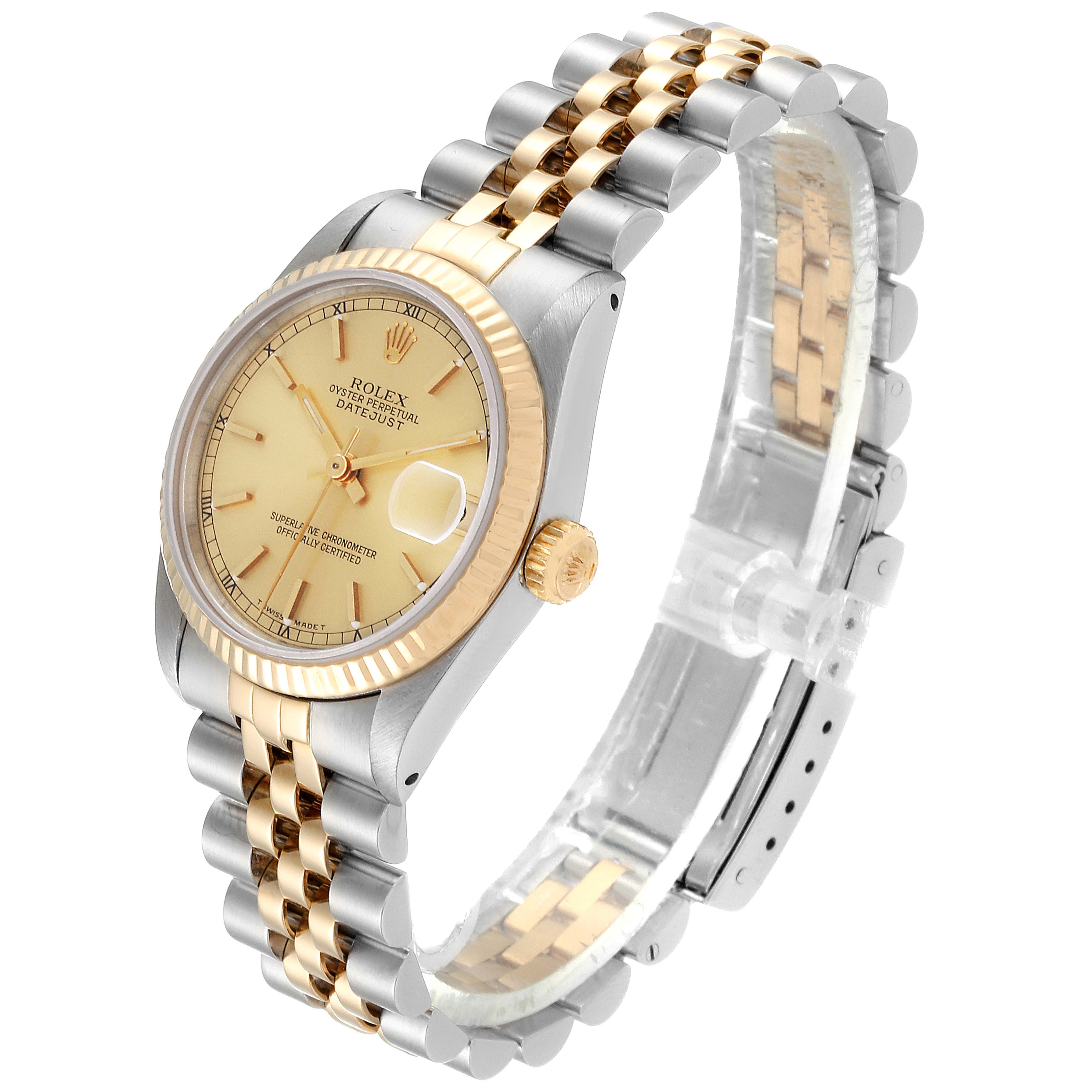 This image shows a Rolex Mid-Size 68273 Women's Steel and Gold (two tone) Champagne Dial 68273 Women's Steel and Gold (two tone) Champagne Dial Datejust watch at a three-quarter angle, highlighting its dial, bezel, and two-tone bracelet.