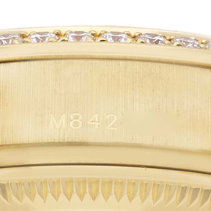 The image shows a close-up of the side of a Rolex President 179138 Women's Yellow Gold Champagne Dial 179138 Women's Yellow Gold Champagne Dial watch, highlighting the gold case and diamond bezel.