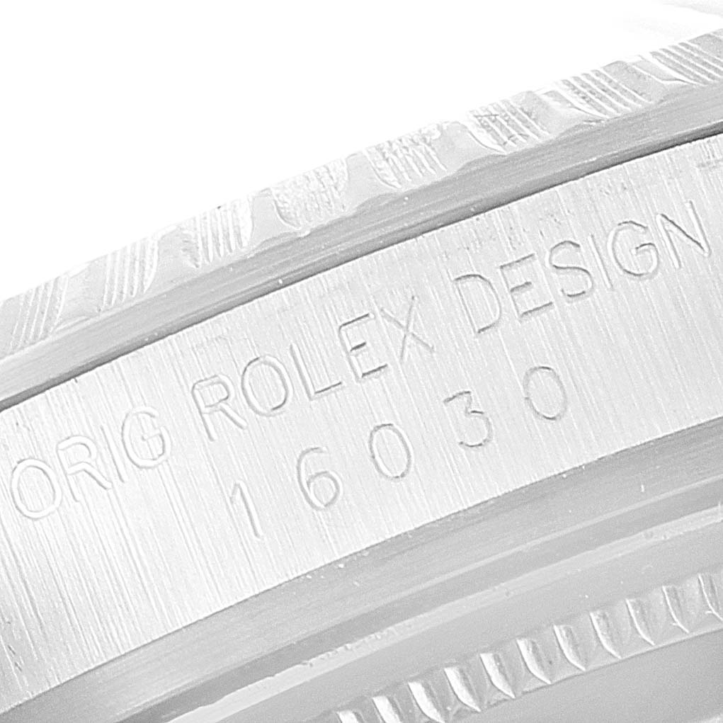 The image shows a close-up angle of the bezel and side of the Vintage Collection model by Rolex, featuring engraved text.