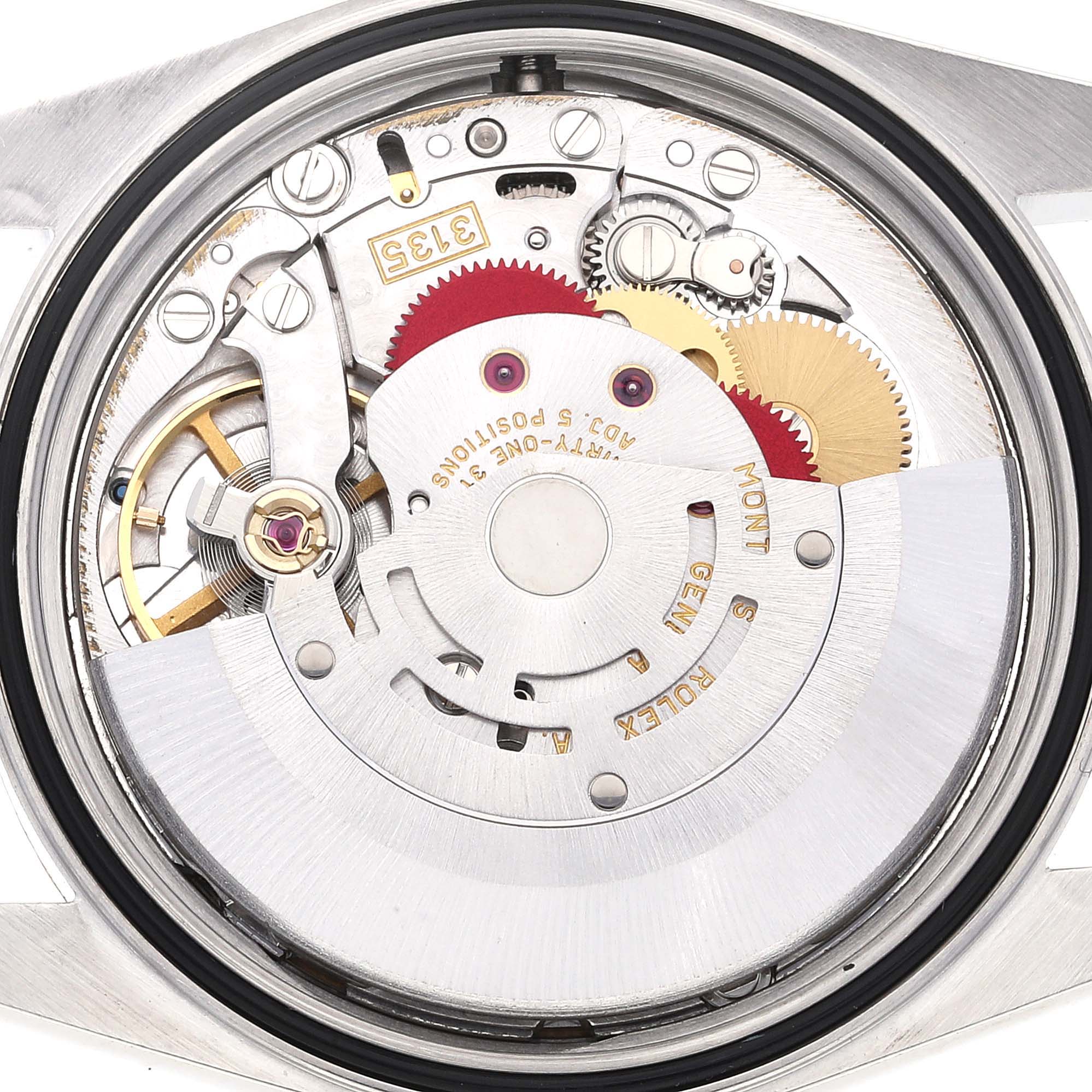 This image shows the inner mechanism of a Rolex Datejust 16233 Men's Steel and Gold (two tone) White Dial 16233 Men's Steel and Gold (two tone) White Dial watch, viewed from the back with the case removed.