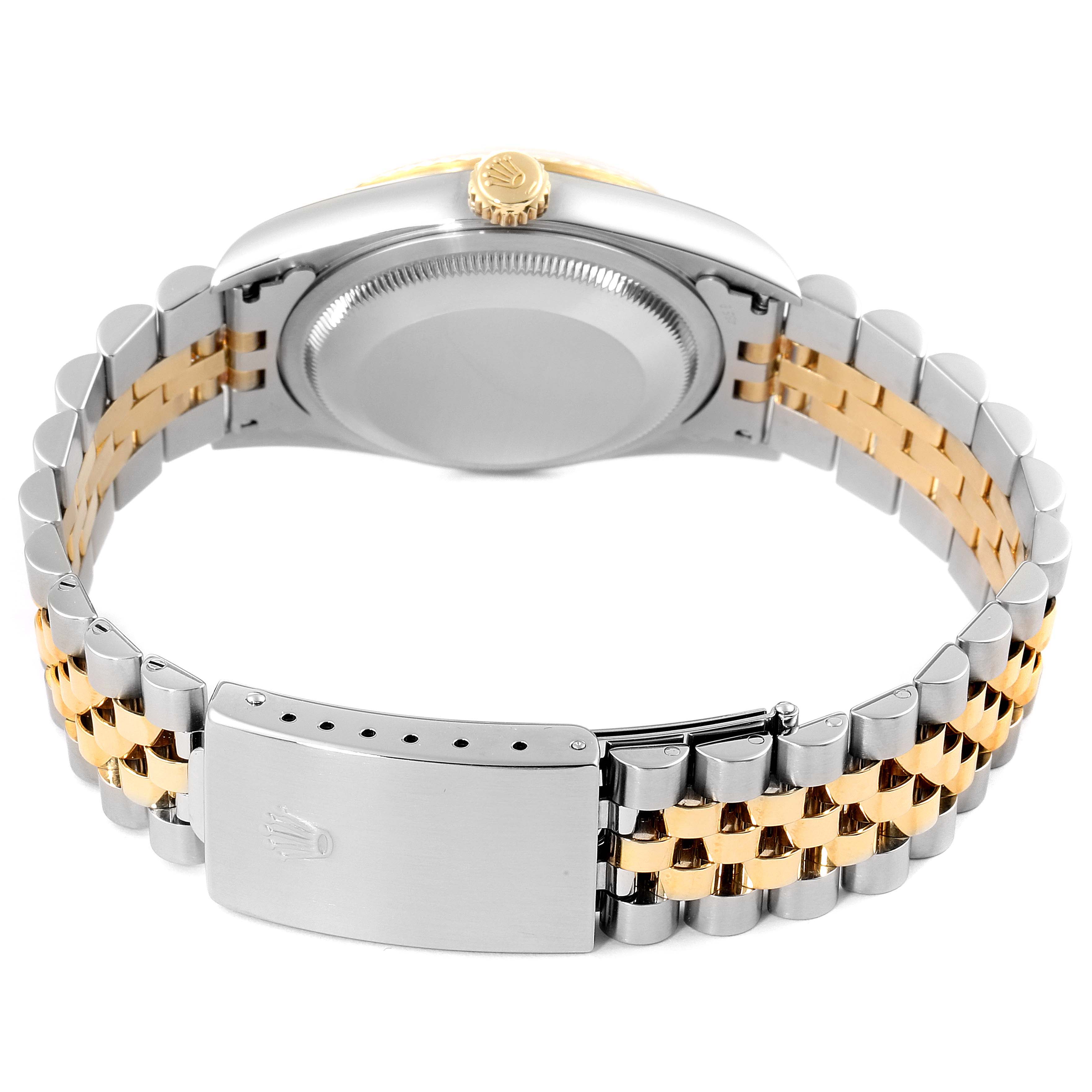 The image shows the back and clasp of a Rolex Datejust 16233 Men's Steel and Gold (two tone) Silver Dial 16233 Men's Steel and Gold (two tone) Silver Dial watch, featuring a jubilee bracelet and crown.