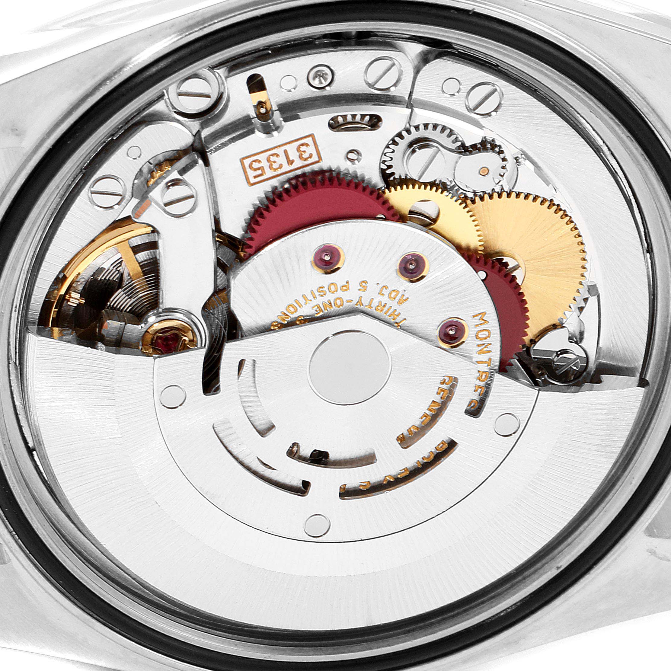 The image shows the internal mechanism of a Rolex Datejust 16233 Men's Steel and Gold (two tone) Champagne Dial 16233 Men's Steel and Gold (two tone) Champagne Dial watch, focusing on its intricate gears and movement components.