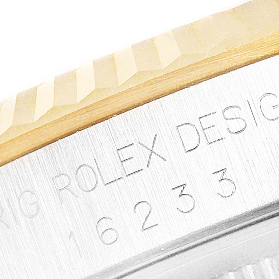 The image shows a close-up of the bezel and engraved text with model identification on a Rolex Datejust 16233 Men's Steel and Gold (two tone) Champagne Dial 16233 Men's Steel and Gold (two tone) Champagne Dial watch.