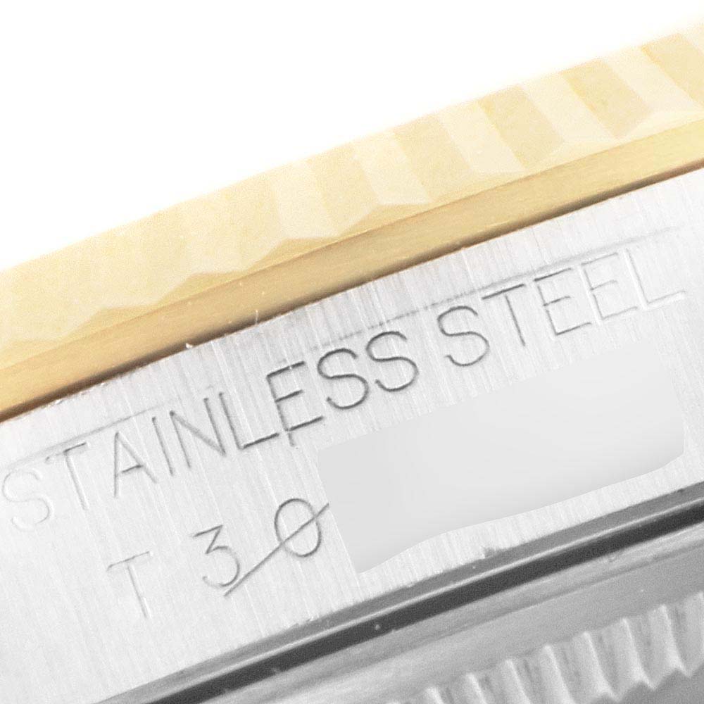 The image shows a close-up of the stainless steel and bezel of a Rolex Datejust 16233 Men's Steel and Gold (two tone) Champagne Dial 16233 Men's Steel and Gold (two tone) Champagne Dial watch.