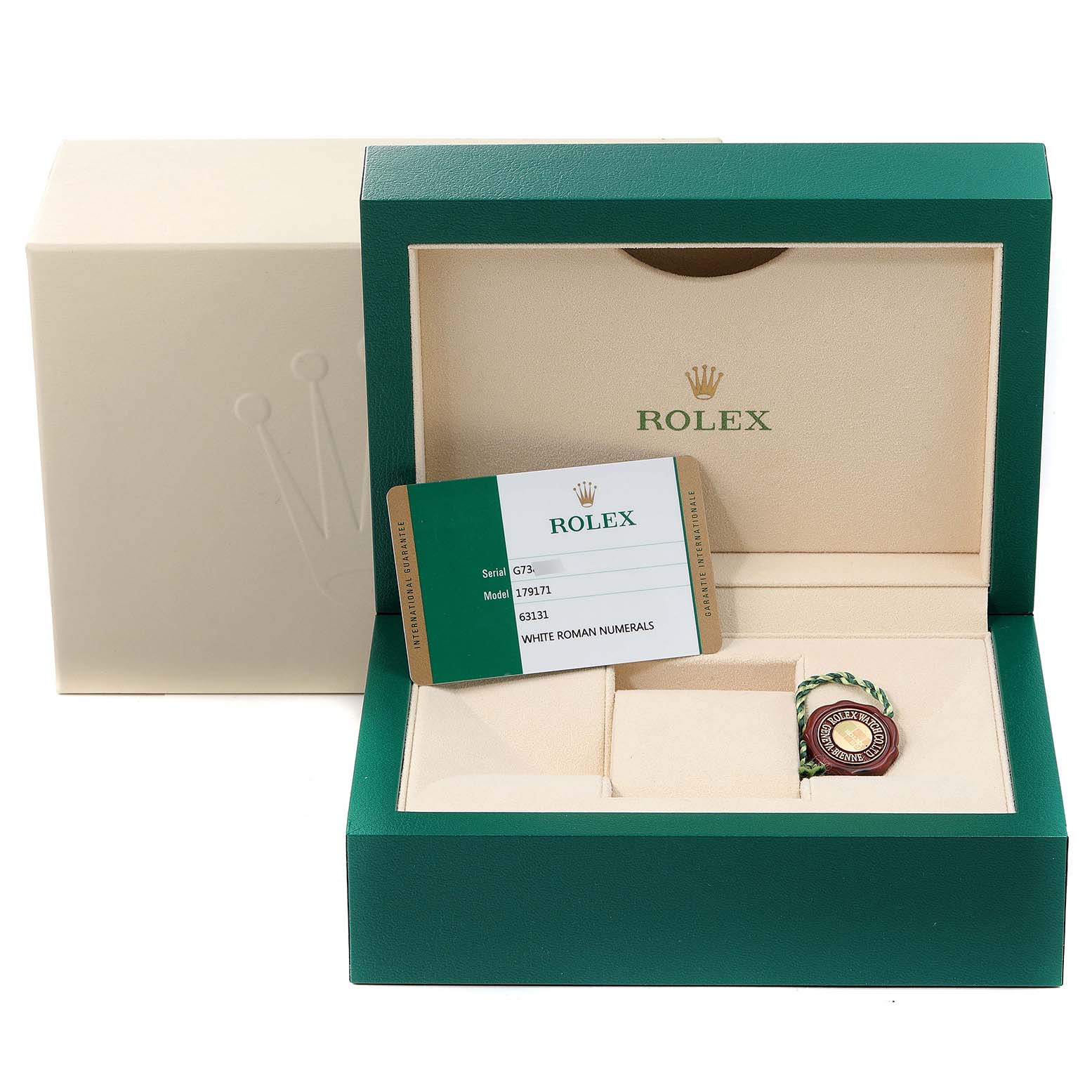 The image shows a green Rolex box open at an angle, revealing an authenticity card and accessories for a Datejust model watch.