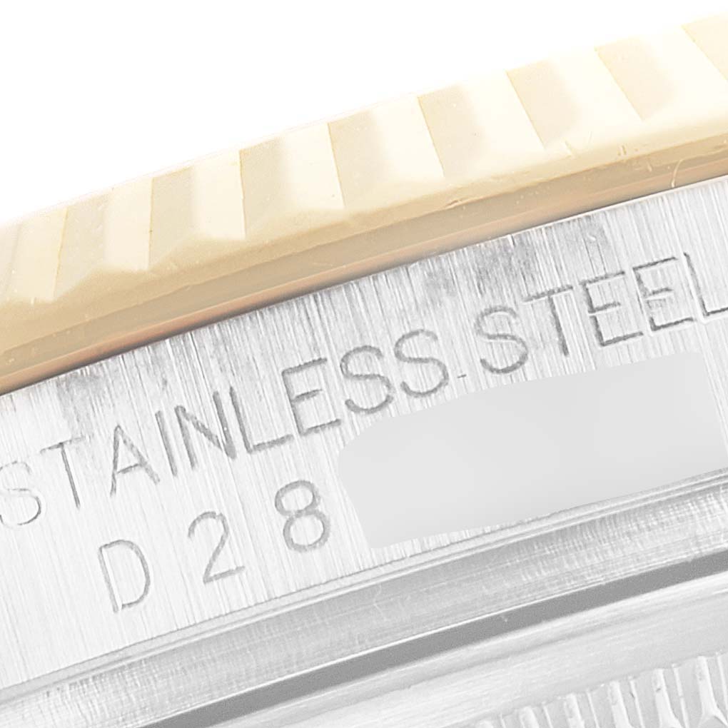 The image shows a close-up angle of the side engraving and bezel detail of a Rolex Datejust 116233 Men's Steel and Gold (two tone) Black Dial 116233 Men's Steel and Gold (two tone) Black Dial watch.