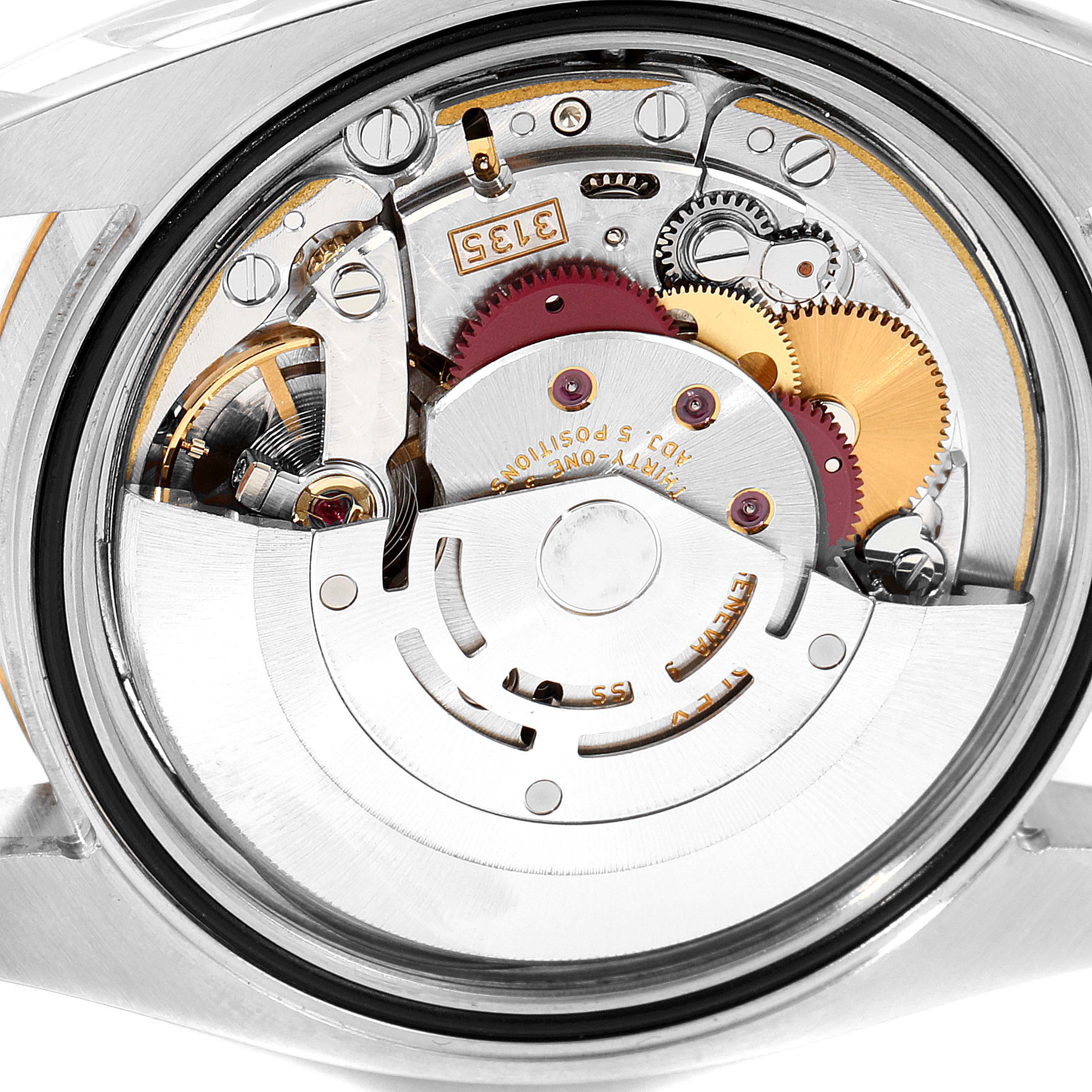 This image shows the back view of a Rolex Datejust 116233 Men's Steel and Gold (two tone) Black Dial 116233 Men's Steel and Gold (two tone) Black Dial watch, highlighting its intricate internal movement and gears.