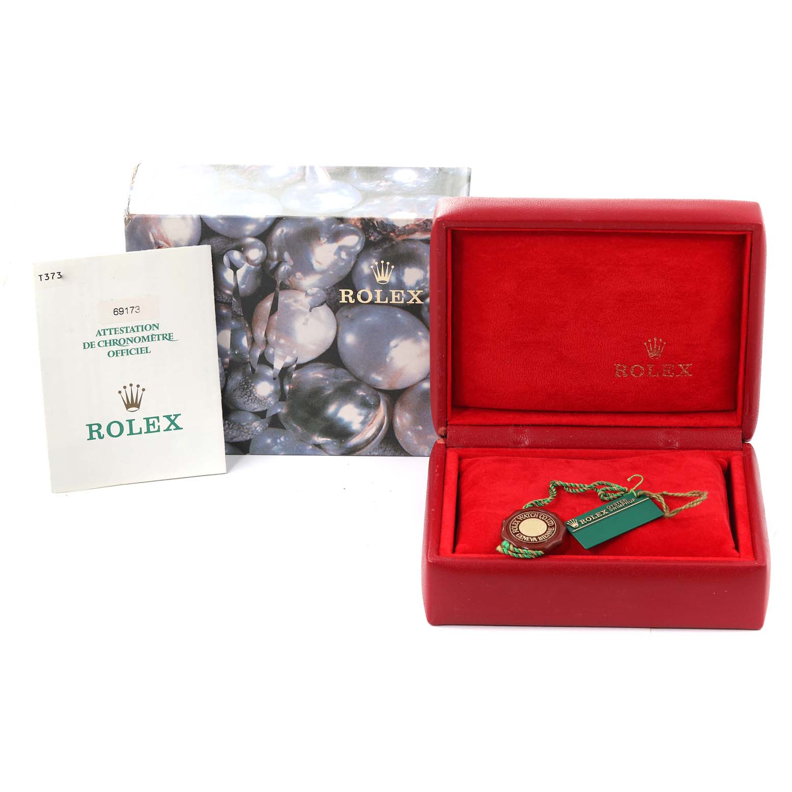 The image shows a Rolex Datejust 69173 Women's Steel and Gold (two tone) Champagne Dial 69173 Women's Steel and Gold (two tone) Champagne Dial model's accessories box, including the watch case, booklet, and tags.