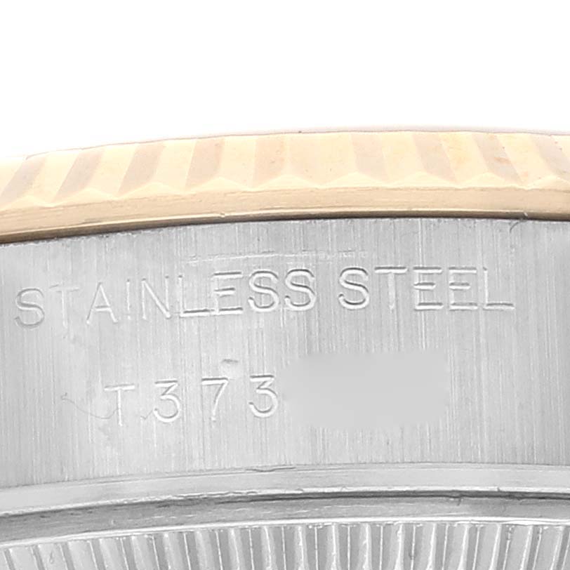 This image shows a close-up of the side of a Rolex Datejust 69173 Women's Steel and Gold (two tone) Champagne Dial 69173 Women's Steel and Gold (two tone) Champagne Dial watch, highlighting the stainless steel material and part of the bezel.