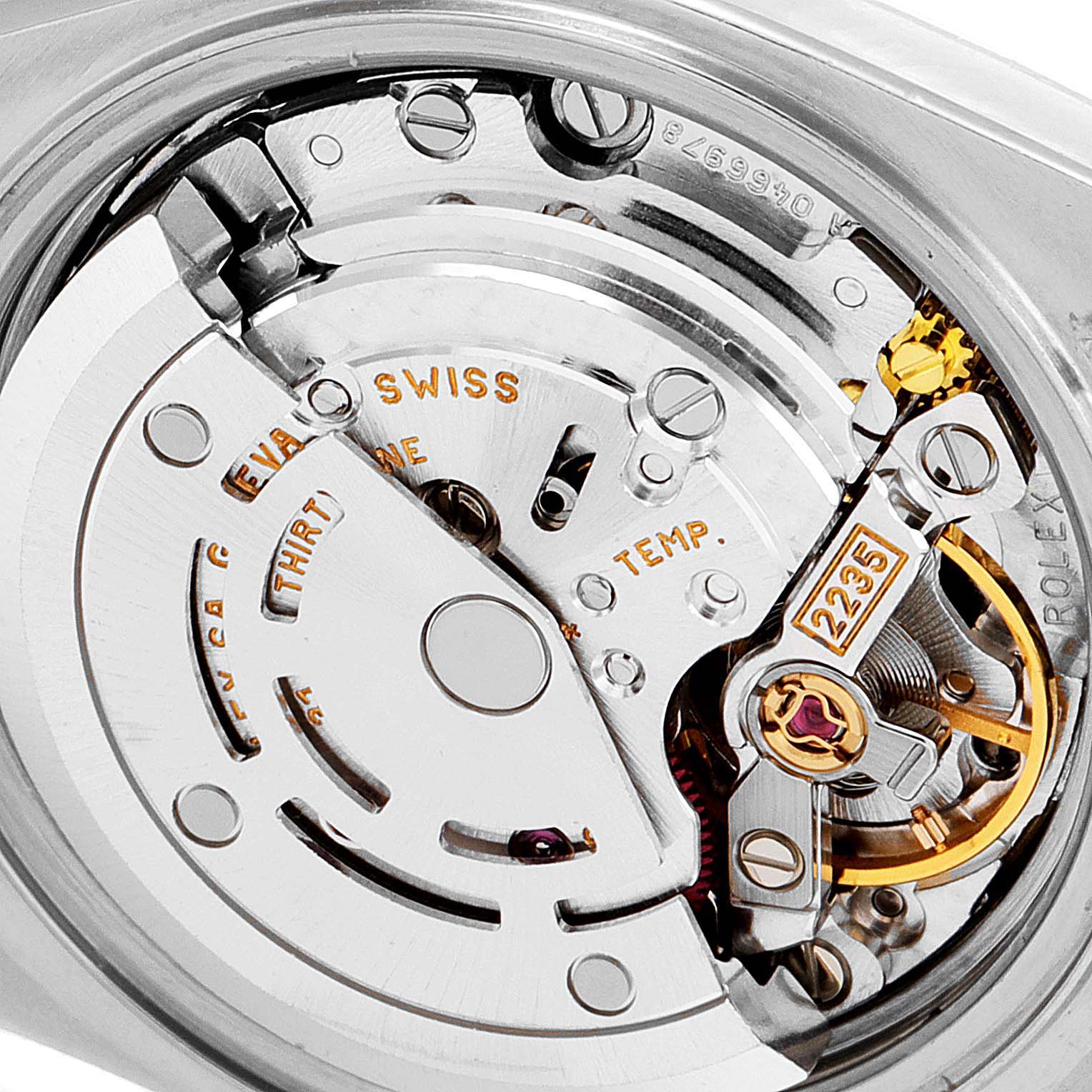 This image shows the movement or internal mechanism of a Rolex Datejust 79173 Women's Steel and Gold (two tone) Champagne Dial 79173 Women's Steel and Gold (two tone) Champagne Dial watch, highlighting intricate components and engravings.