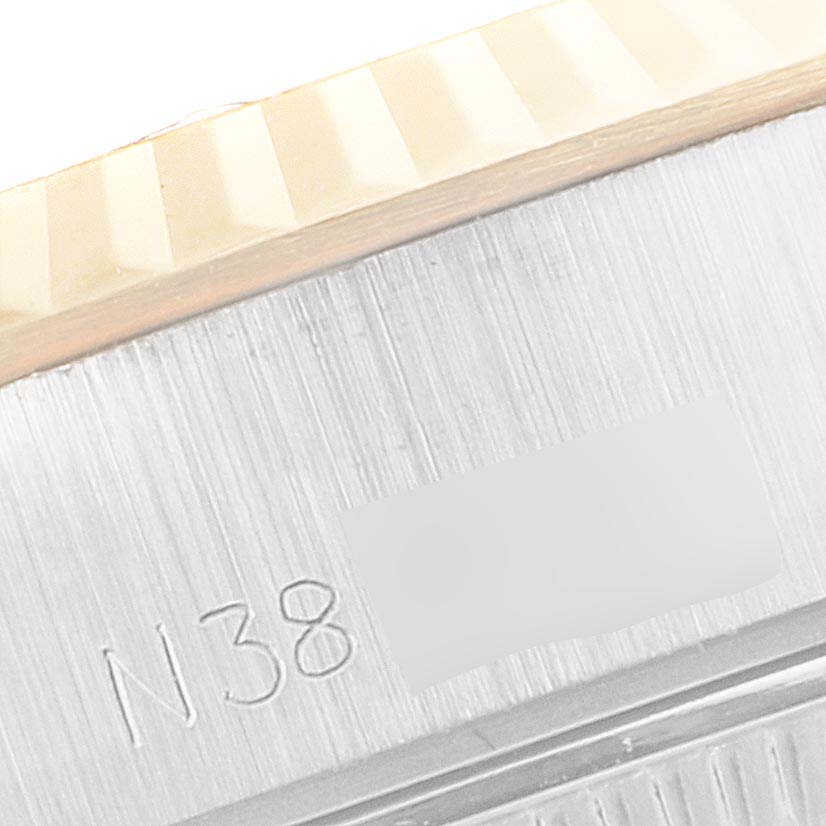 This image shows a close-up of the serial number area on the side case of a Rolex Datejust 69173 Women's Steel and Gold (two tone) Champagne Dial 69173 Women's Steel and Gold (two tone) Champagne Dial model watch.