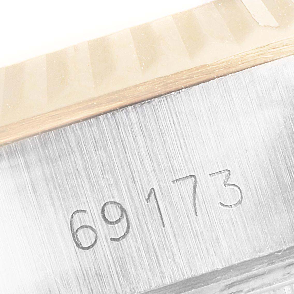 The image shows a close-up of the case side and model number engraving (69173) of a Rolex Datejust 69173 Women's Steel and Gold (two tone) Champagne Dial 69173 Women's Steel and Gold (two tone) Champagne Dial watch.