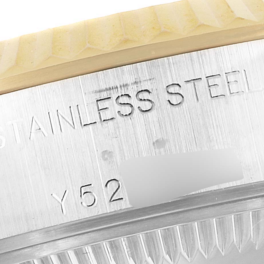 The image shows a close-up angle of the stainless steel case-back with part of the serial number on a Rolex Datejust 79173 Women's Steel and Gold (two tone) Beige Dial 79173 Women's Steel and Gold (two tone) Beige Dial watch.