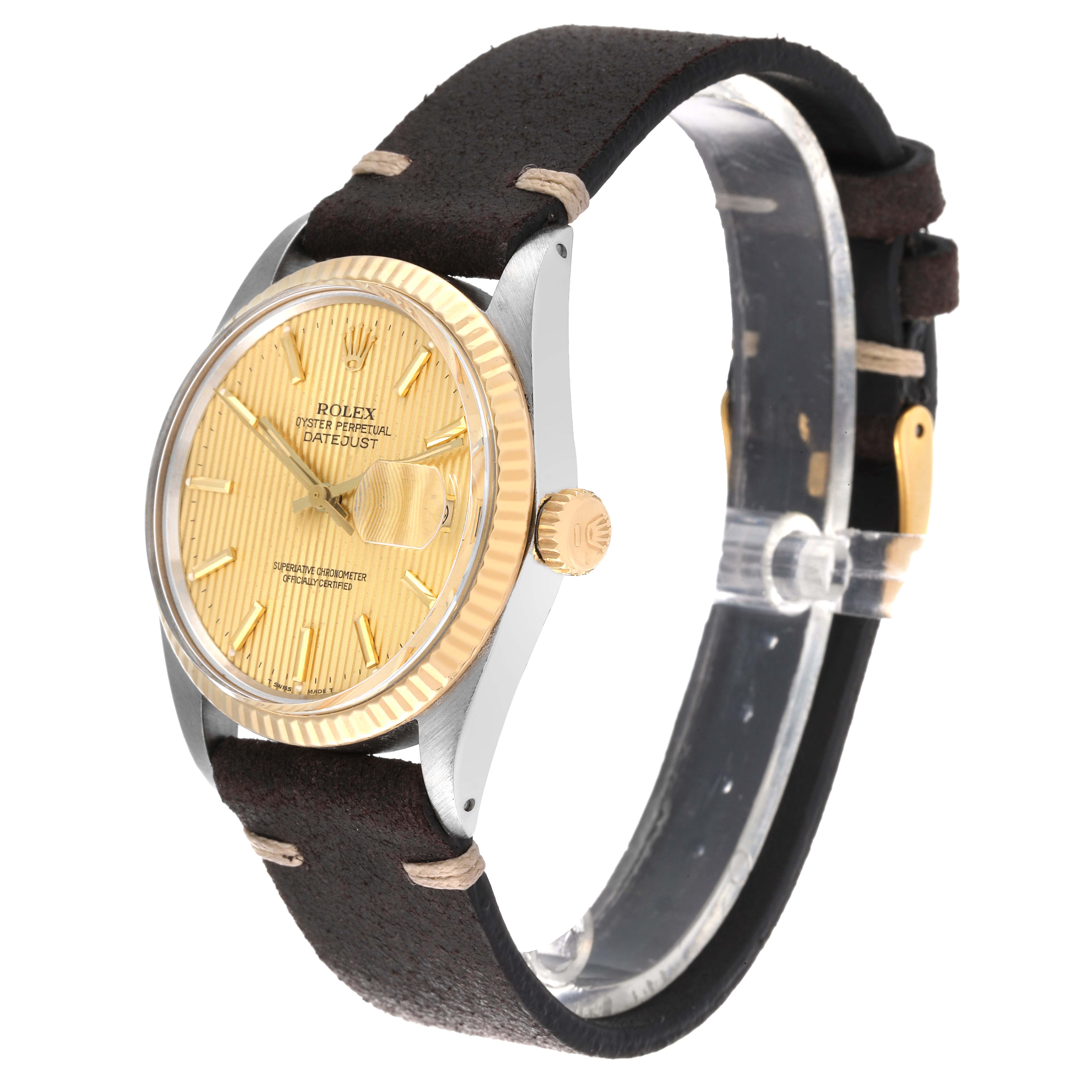 This image shows a side angle of a Rolex Datejust 16013 Men's Yellow Gold Champagne Dial 16013 Men's Yellow Gold Champagne Dial watch, highlighting its dial, bezel, crown, and leather strap.