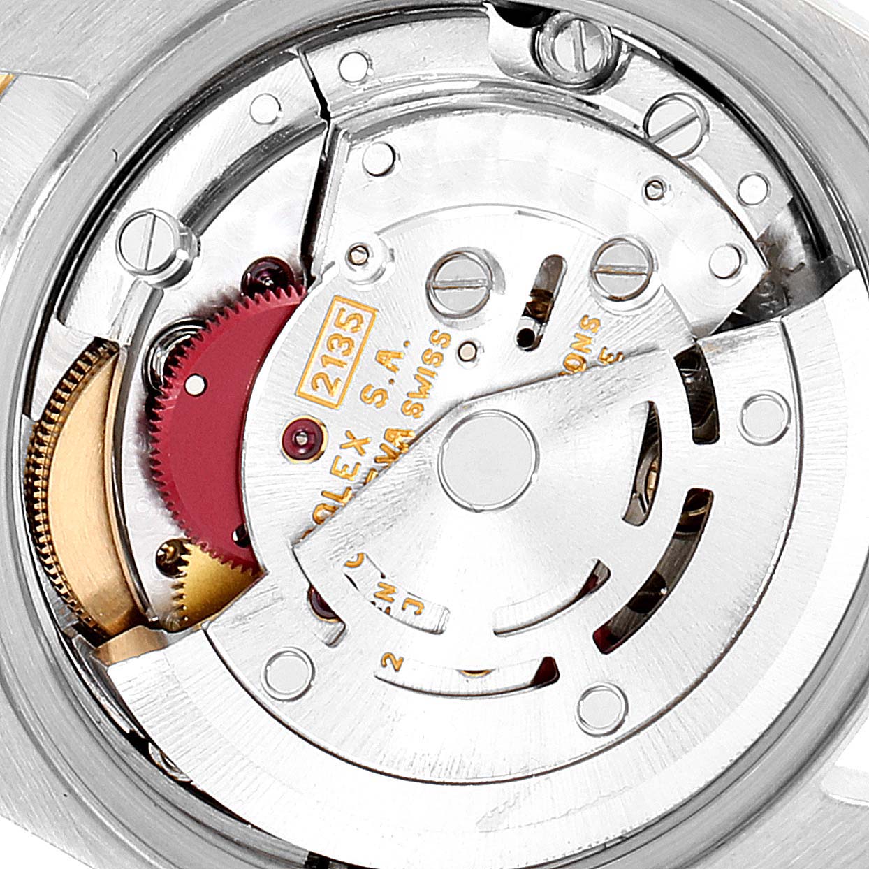 This close-up image showcases the intricate inner mechanism of a Rolex Datejust 69173 Women's Steel and Gold (two tone) White Dial 69173 Women's Steel and Gold (two tone) White Dial watch, specifically its movement.