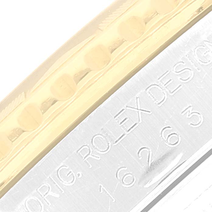 This image shows a close-up of the side view of the bezel and engraved case of a Rolex Turn-o-Graph 16263 Men's Steel and Gold (two tone) White Dial 16263 Men's Steel and Gold (two tone) White Dial model.