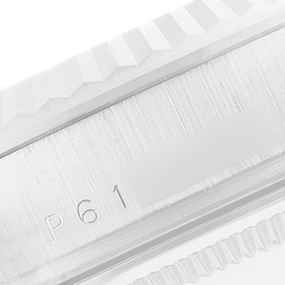 This image shows a close-up of the brushed metal caseback and edge markings of a Rolex President 118239 Men's White Gold Silver Dial 118239 Men's White Gold Silver Dial model watch.